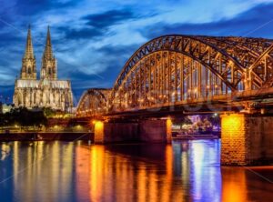 Hohenzollern Bridge and gothic Cathedral in Cologne city, Germany