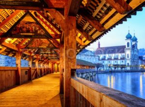 View through historical wooden Chapel Bridge to the old town of Lucerne, Switzerland