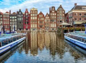 Damrak canal in the Old town of Amsterdam, Netherlands