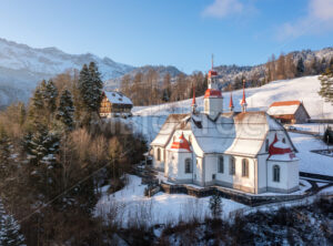 Hergiswald church in the snow covered Alps mountains, Lucerne, Switzerland