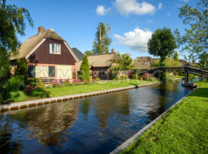 Houses on water canal in Giethoorn village, Netherlands