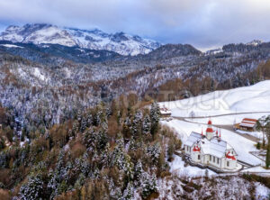 Hergiswald church in Alps mountains, Switzerland, in winter