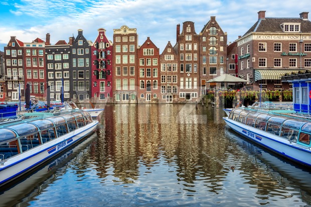 Damrak canal in the Old town of Amsterdam, Netherlands Stock Photo