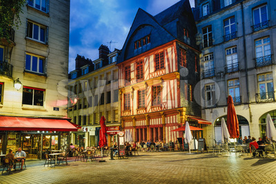 Street cafes in Nantes city at night, France Stock Photo