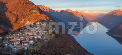Lake Lugano and Alps mountains on sunset, Switzerland Stock Photo