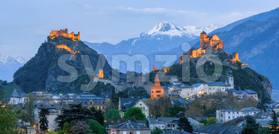 Historical Sion town with its two castles at late evening Switzerland Stock Photo