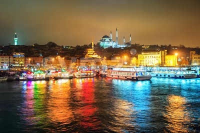 Fish boat restaurants on Golden Horn at night, Istanbul, Turkey Stock Photo