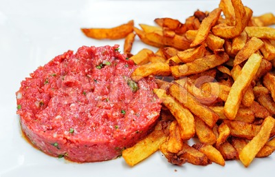 Steak tartare served with french fries potato chips Stock Photo