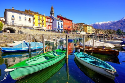 Colorful boats in olt town of Ascona, Ticino, Switzerland Stock Photo