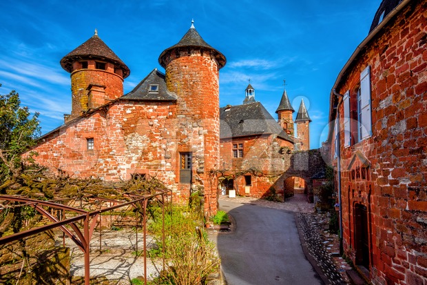 Collonges-la-Rouge, red brick houses and towerd of the Old Town, France Stock Photo
