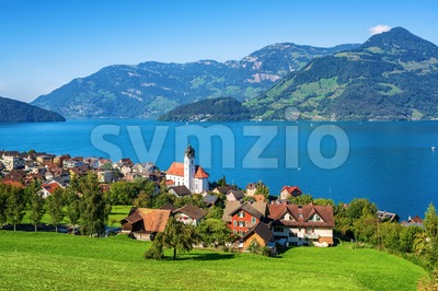 Traditional village on Lake Lucerne in swiss Alps, Switzerland Stock Photo
