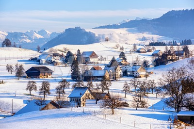 A snow covered village in swiss Alps, Switzerland, in winter time Stock Photo