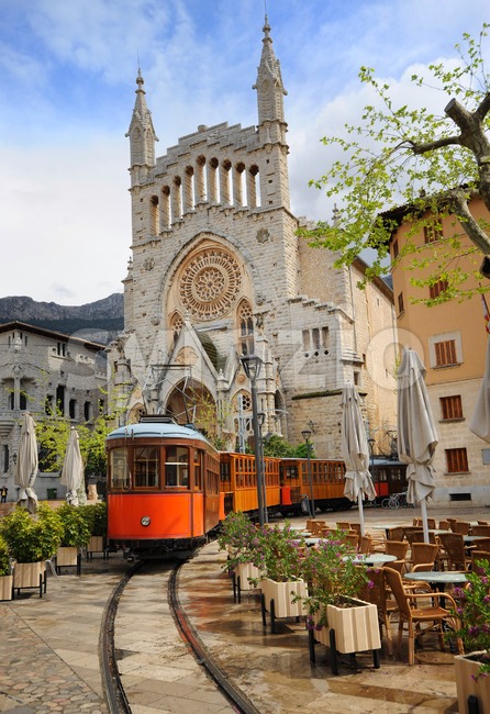 Old tram in front of the Cathedral of Soller, Mallorca, Spain Stock Photo
