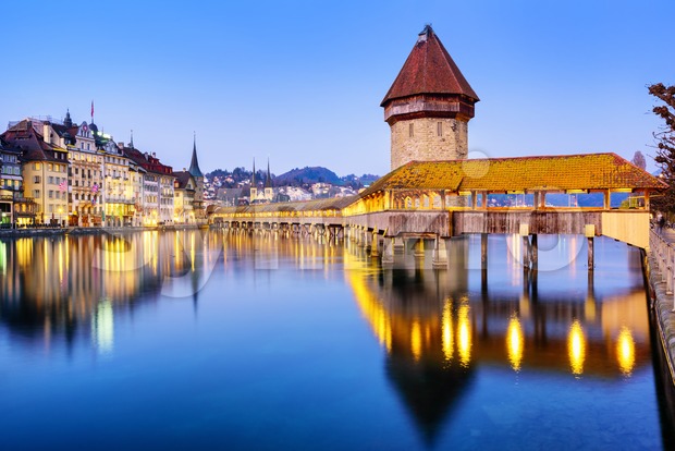 Chapel bridge in Lucerne city, Switzerland, on a blue evening Stock Photo
