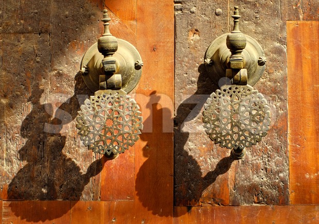 Moroccan decorated bronze door knobs, Morocco Stock Photo