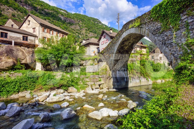 Roman bridge in Giornico village, Switzerland Stock Photo